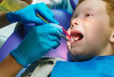 Child having their mouth examined by pediatric emergency dentist in Pickering