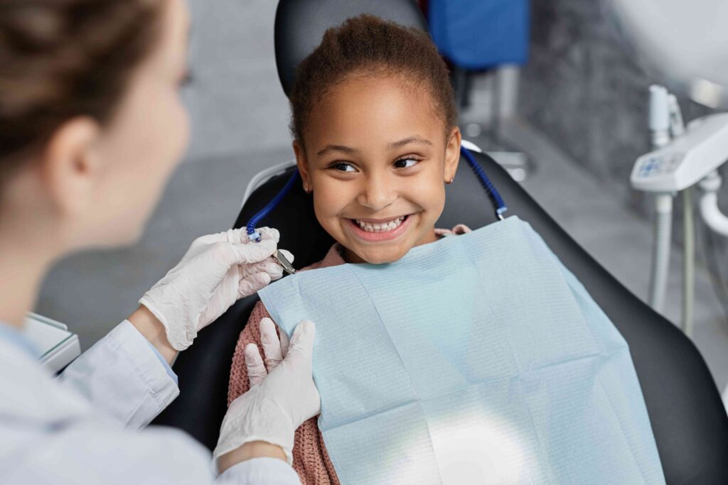 Child smiling in the dental chair